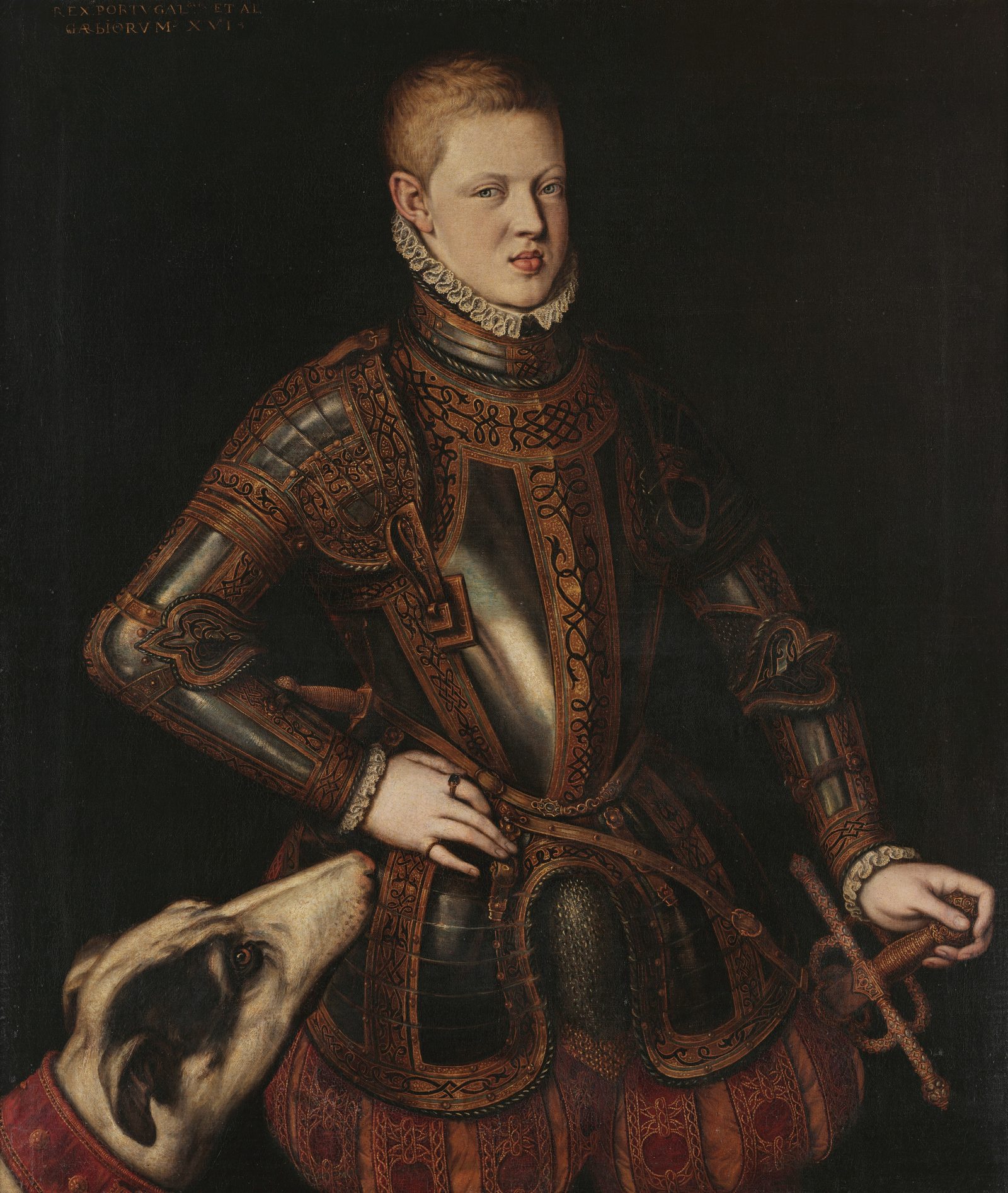 Portrait of the young King Sebastião in a white lace ruff and gold-damascened armor over red breeches, hand on sword hilt, a red-collared hound at his side