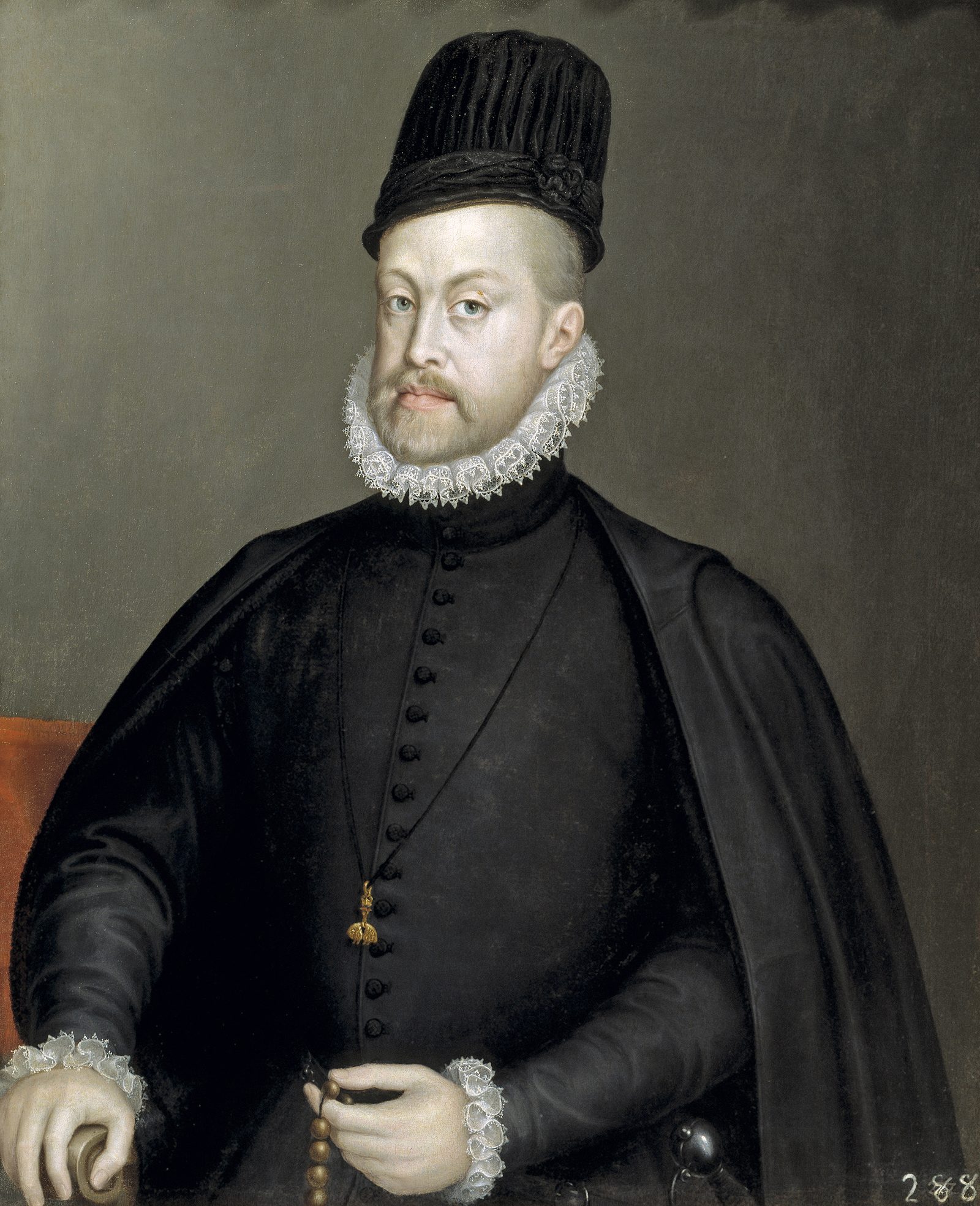 Philip II of Spain in black: tall black cap, narrow lace ruff, the Golden Fleece pendant on his doublet, a rosary in his left hand, plain gray ground