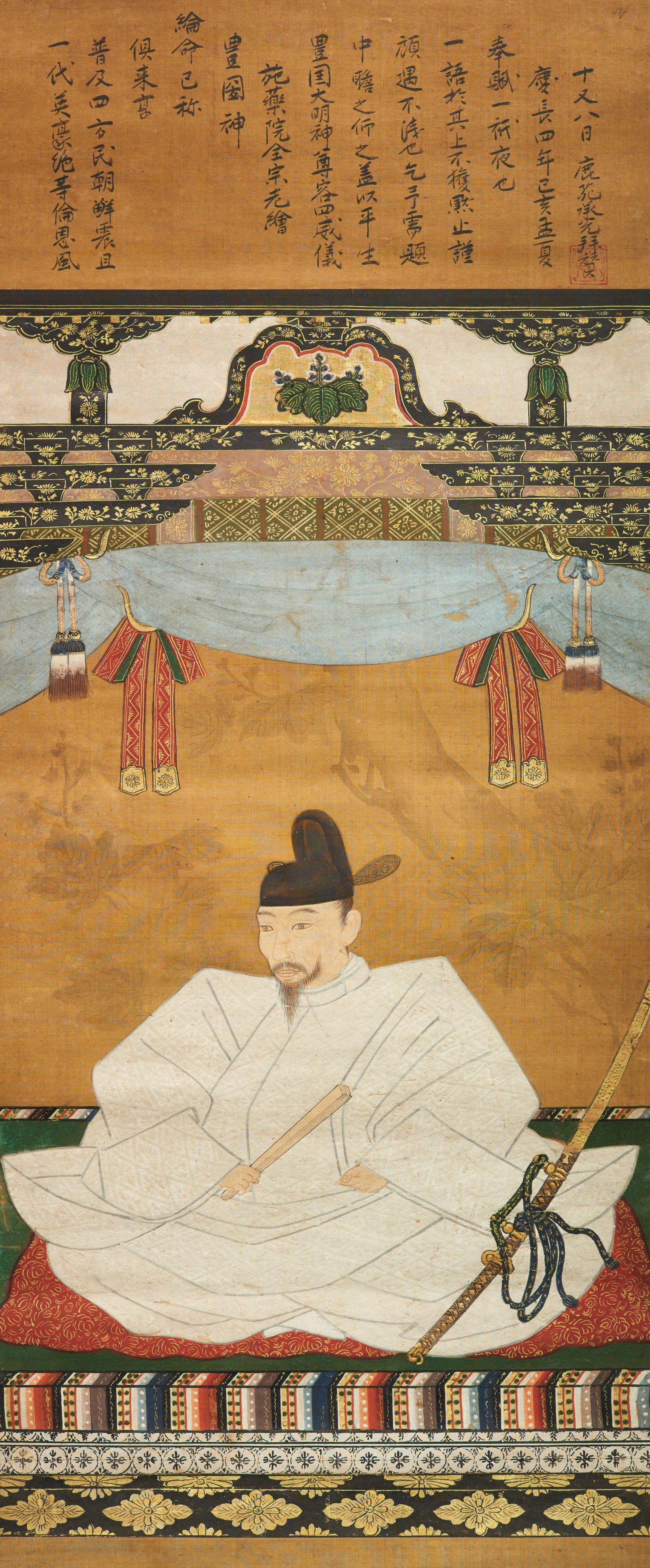 Memorial portrait of Toyotomi Hideyoshi, 1599, seated in white court robes on a red cushion beneath a gilded canopy with the paulownia crest, baton in hand
