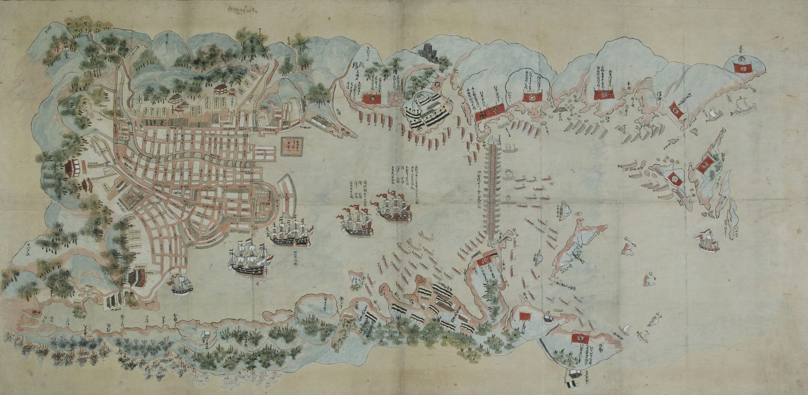 Colored map of Nagasaki Bay: the town's street grid at left, European ships at anchor mid-harbor, a bridge of boats across the bay, red banners on the shores